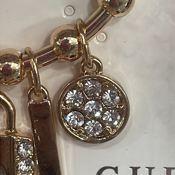 BNIB Guess Logo Rhinestone Lock & Key Charm Bracelet Earring Set Gold Tone 3 pc - Picture 7 of 8